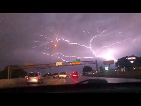 Lightning Spreads Across Sky over Highway Traffic - 1049406