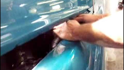 removing a hood hinge spring