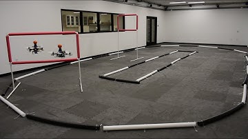 A Real-Time Game Theoretic Planner for Autonomous Two-Player Drone Racing