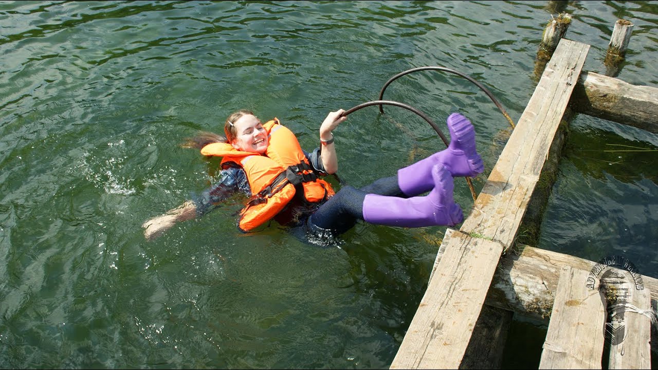 Fun swimming in purple rainboots