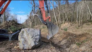 Kubota KX0574 mini ex vs 3700lb boulder.