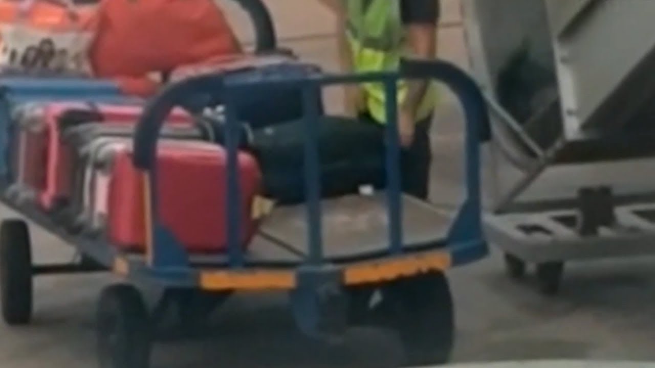 Baggage handler steals from passenger's luggage in YouTube