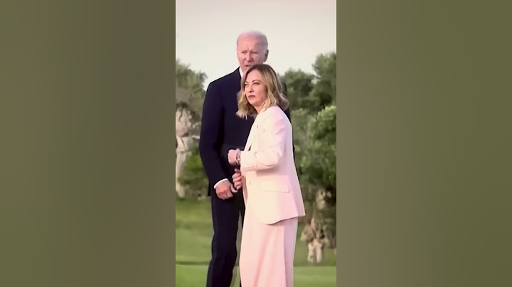 Joe Biden appears to wander off at G7 summit in Italy before being pulled back by Italian PM