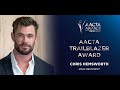 Russell crowe presents chris hemsworth with the 2022 aacta trailblazer award