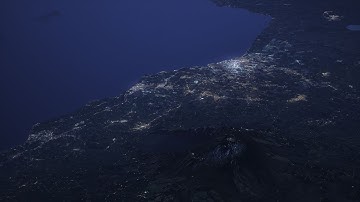 Вулкан Этна. Ночные огни Катании, Милаццо, Реджо-Калабрия, Мессина и других городов.