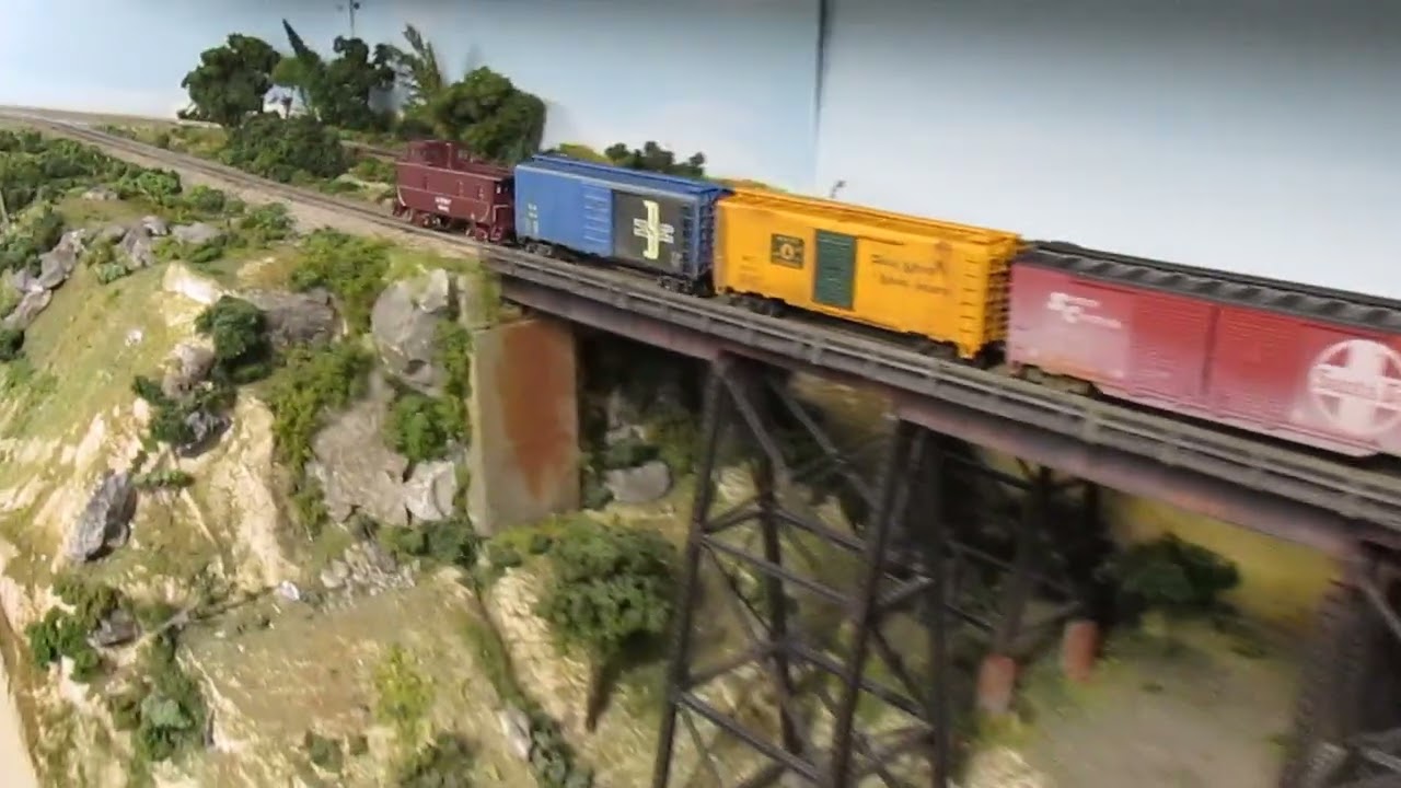 Santa Fe "Warbonnet" EMD F 3 diesel locomotives, power a freight extra.