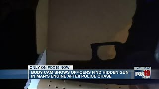 Body cam shows officer find hidden gun in man's engine after police chase