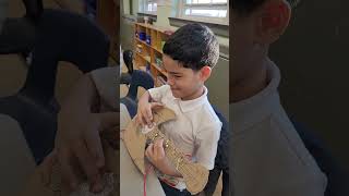 A on his makey makey guitar