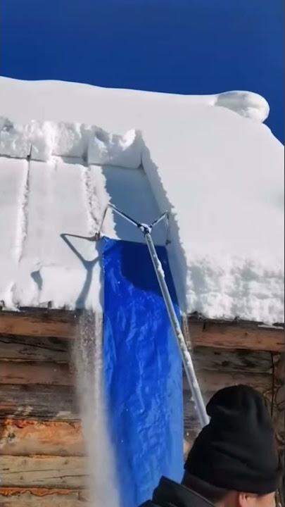Shoveling snow off of roof