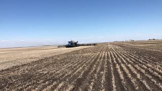 T9700 NH tractor seeding with 100 foot seed master air drill with NH3 and 4590 NH air tank