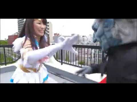 Superheroine Sailor Moon Blue hit by an illusion technique from Dracula Monster