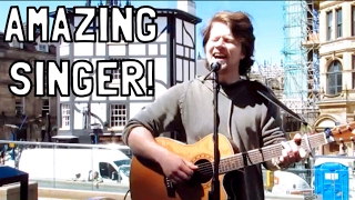 Heartfelt Performance: Busker's rendition of Bridge Over Troubled Water in Manchester