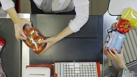 hands of cashier scanning products YRBCV75