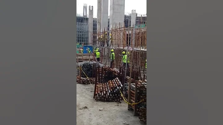 Scaffolding erection work and the sound of construction site.