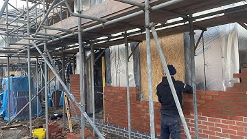 Laying some facing brick on timber frame new builds (bricklaying).