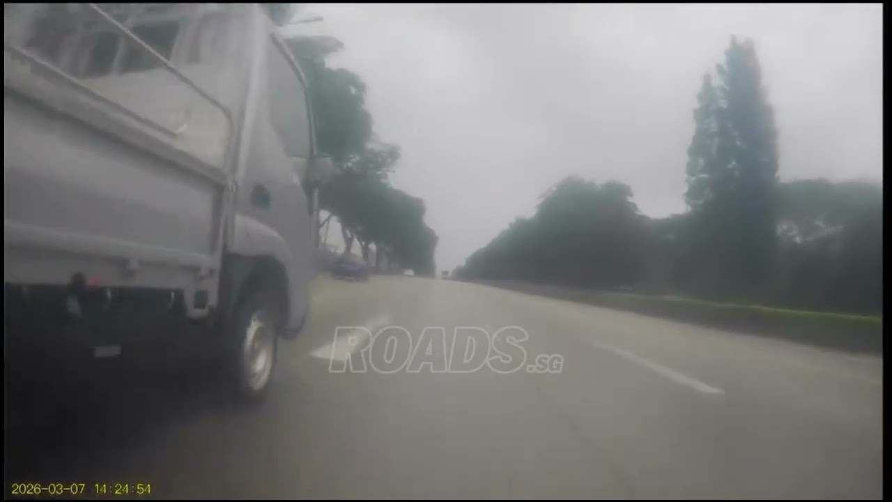 A vehicle dangerously changed lanes without checking the blind spot.