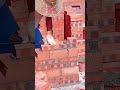 The carpenter arranges red bricks with cement mortar #shorts