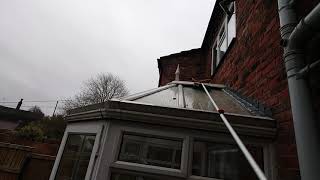 Conservatory roof cleaning with water fed pole