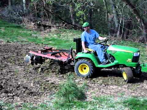 john deere x700 with 3 point disc at work youtube