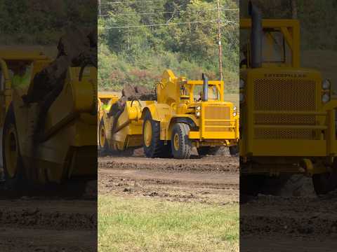 Cat 660 with 650 bowl getting push loaded by a double D9 dozer at The Century of Caterpillar event