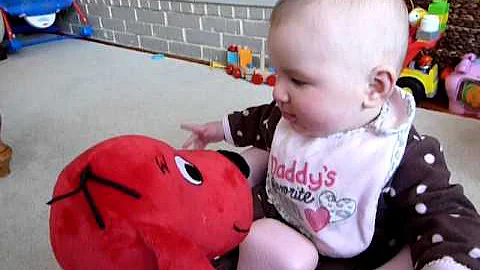 Hazel kisses/eats Clifford