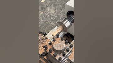 The CNC wood lathe with a chuck processes a wooden seal.  #cnc   #machine