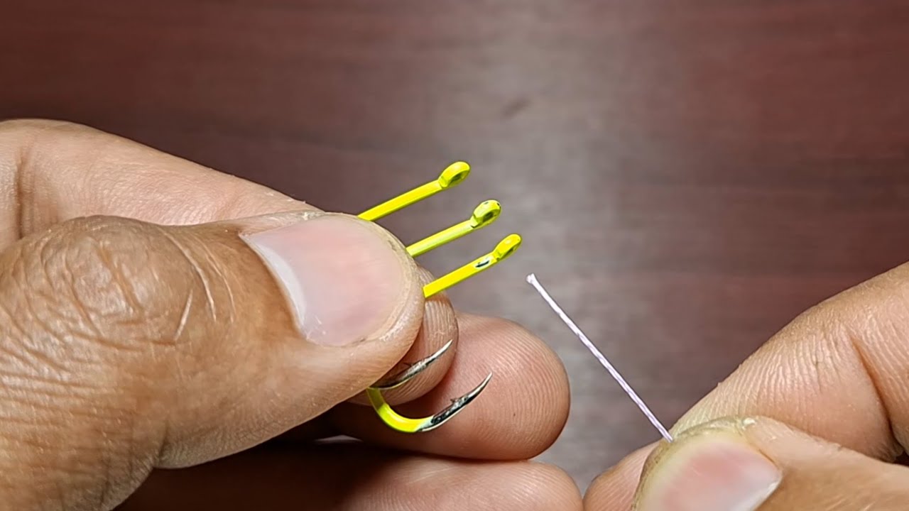 Easy trick in tying fishing hooks, 3 hooks in one straight line #fishingknot #fishinghook Easy trick in tying fishing hooks, 3 hooks in one straight line #fishingknot #fishinghook