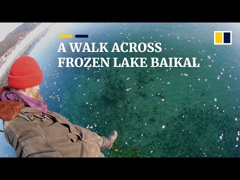 Russian man films thrilling walk across frozen ice on world’s deepest lake