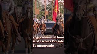 Kyrgyz mounted honor guard escorts President Xis motorcade