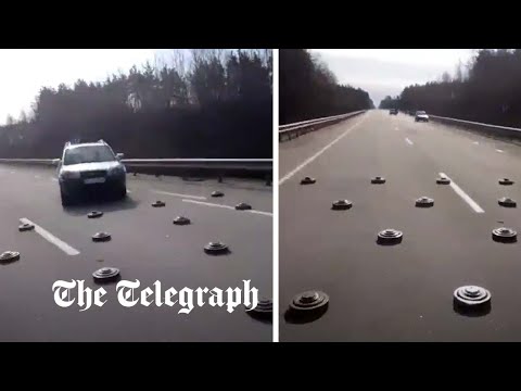 Nerve-wracking footage shows Ukrainian drivers crossing over Russian landmines
