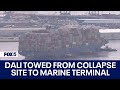 Baltimore key bridge collapse dali refloated being moved to nearby marine terminal