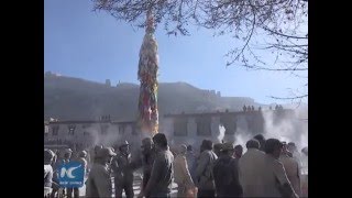 Tibetans throw flour, raise prayer flags for good luck