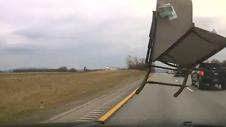 Raw Video: Lawn Chair Comes Flying Out Of Pickup Truck, Hits Vermont State Police Cruiser