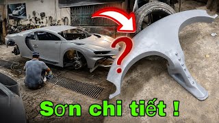 Painting the details of a Bugatti Chiron supercar
