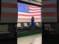 Koumba singing the national anthem at SCE’s 2025 Multicultural event