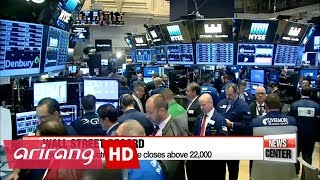 Dow Jones industrial average closes above 22,000 for first time