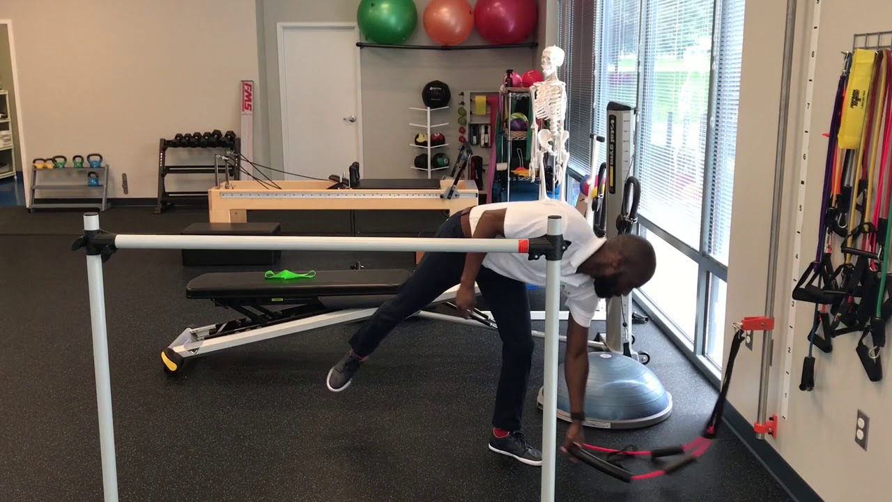 Single leg squat with band to assist with hip strength and motor ...