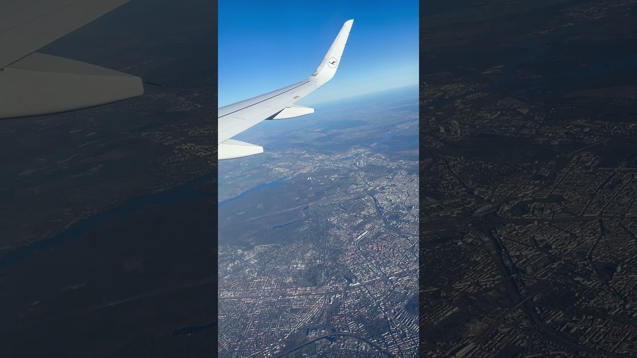 Airplane above the clouds from plane window. Amazing sky view from plane window 