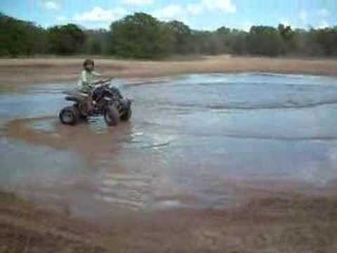 jesse and tammie on four wheelers 1