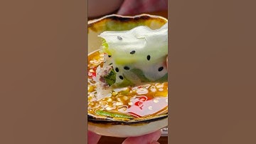 Cá nục hấp cuốn rau muống/Steamed round scad fish wrapped in soft rice paper