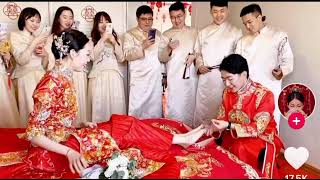 Asian Simp Kisses Feet Of Queen At Wedding