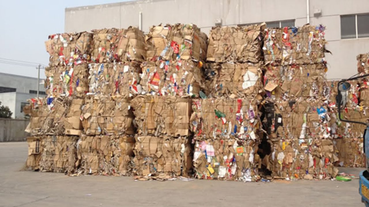 Baling Newspaper With A Downstroke Baler