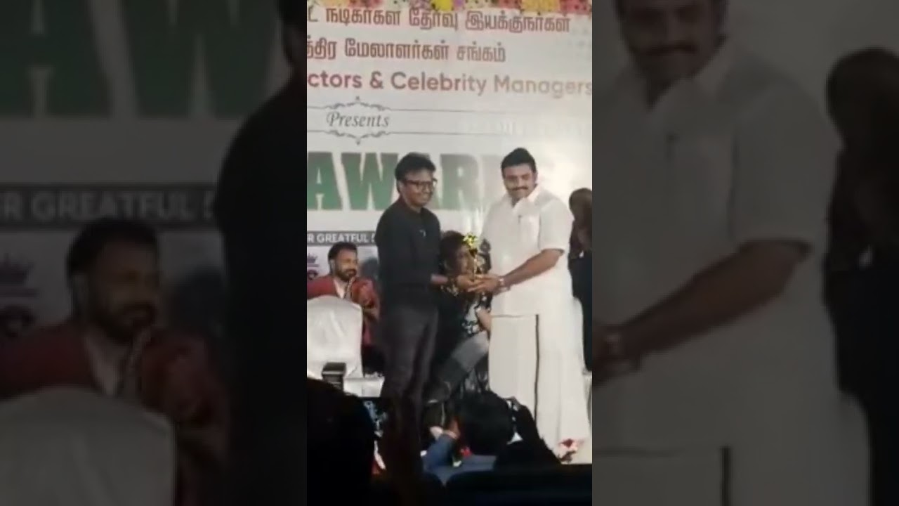 d iman receiving award with actress ambika