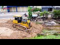 Great team work land fill up processing dump truck unloading  soil  dozer shantui b2 pushing soil