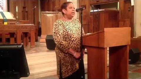 Rev. Tonya Fields singing "To God Be the Glory" at...