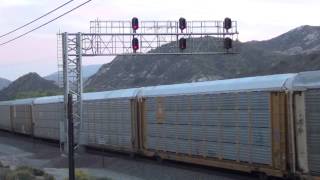 EBD BNSF Stack / Autorack train passes signal bridge @ Old Cajon, CA station stop 10/17/14