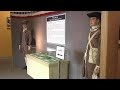Explore Revolutionary War exhibit featuring historic paintings and global impact at museum expo