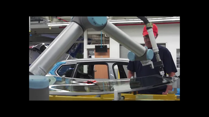 Universal Robot UR10 and humans working collaboratively in a automotive factory.