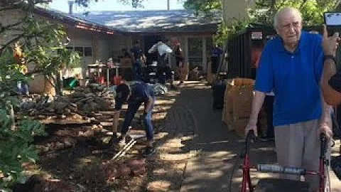 Volunteers surprise WWII veteran with home improve...