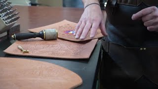 Inmate craftsmen at Fremont Correctional Facility's leather shop create a piece of Colorado history